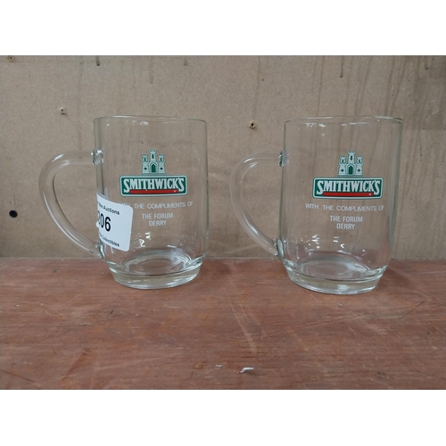 206 - Two Smithwick's glasses with the compliments of The Forum Derry {13 cm H x 13 cm W x 9 cm D].