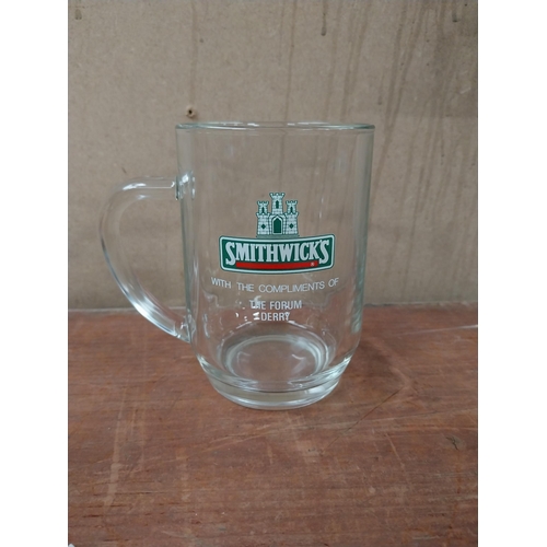 206 - Two Smithwick's glasses with the compliments of The Forum Derry {13 cm H x 13 cm W x 9 cm D].