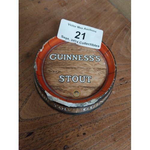 21 - Guinness ceramic ashtray in form of barrel top. {4 cm H x 13 cm Diam.}.