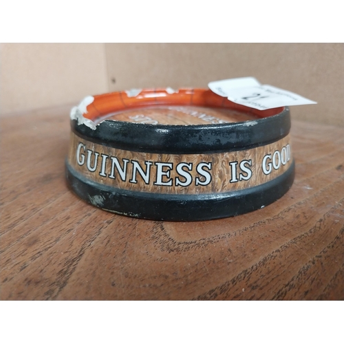 21 - Guinness ceramic ashtray in form of barrel top. {4 cm H x 13 cm Diam.}.