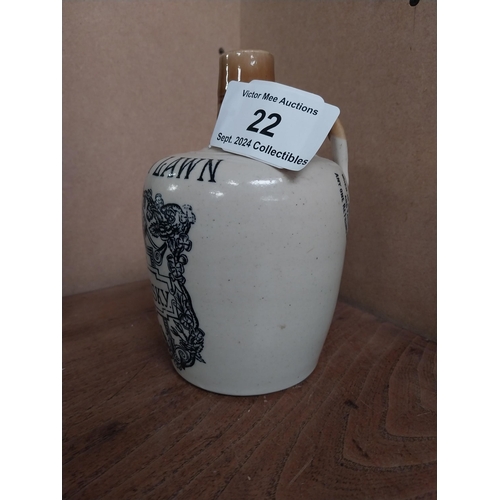 22 - 19th C. Cruiskeen Lawn Old Irish Whiskey stoneware flagon. {19 cm H x 11 cm W x 11 cm D}.