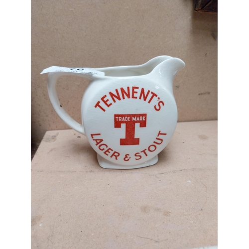 76 - Tennents Lager and Stout ceramic advertising water jug. {12 cm H x 16 cm W x 9 cm D}