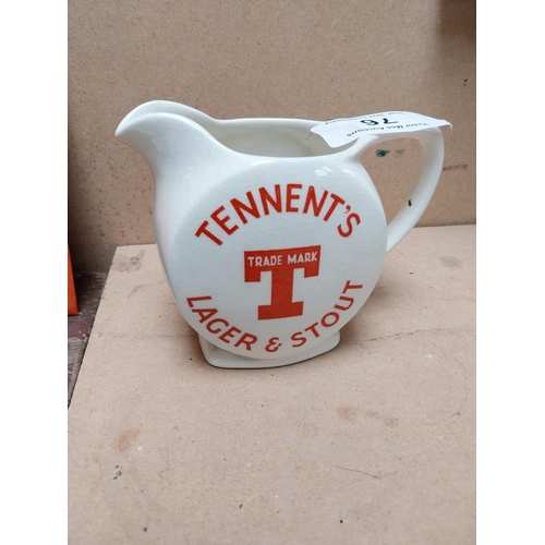 76 - Tennents Lager and Stout ceramic advertising water jug. {12 cm H x 16 cm W x 9 cm D}