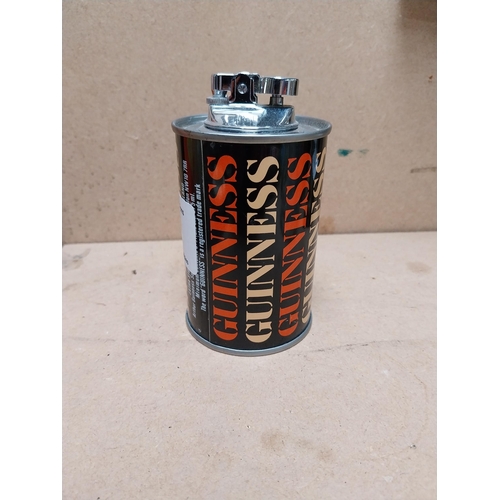 77 - Guinness tin plate Cigarette lighter in original box. {12 cm H x 7 cm Diam.}.