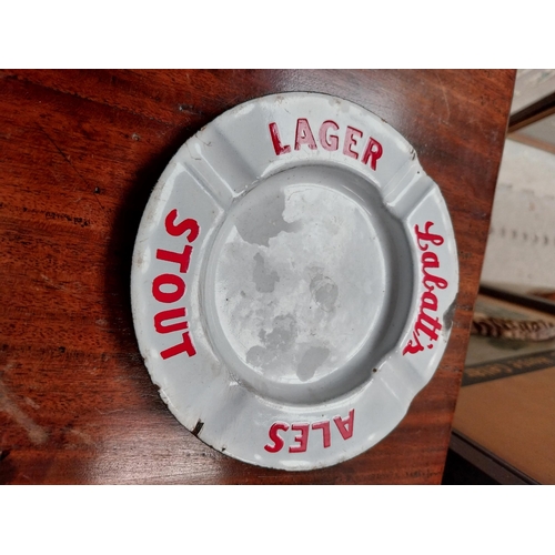 81 - Two Labatt's Ales Stout and Lager enamel ashtrays. {15 cm Diam.}