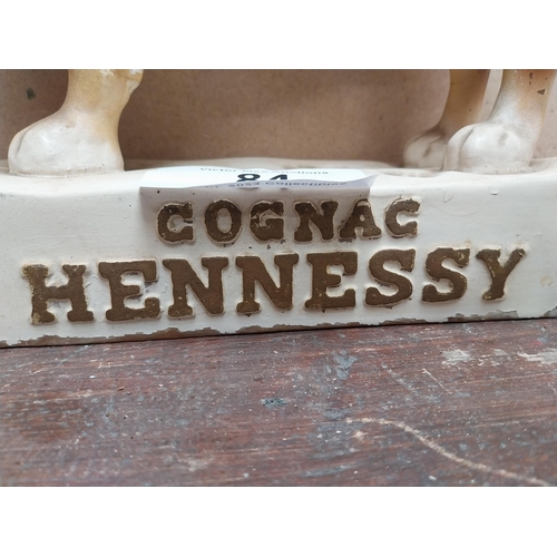 84 - Hennessey Cognac rubberoid advertising Dog figure. {24 cm H x 26 cm W x 9 cm D}.