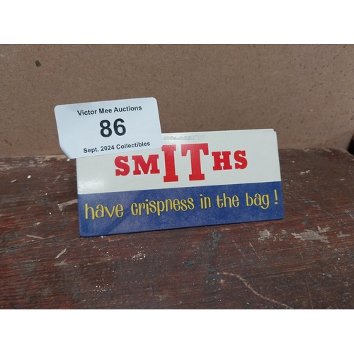 86 - Smith's Crisps in the bag tin plate advertising sign. {10 cm H x 7 cm W}.