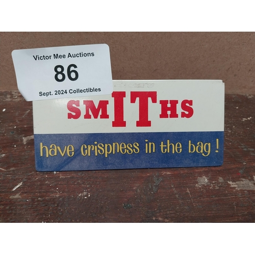 86 - Smith's Crisps in the bag tin plate advertising sign. {10 cm H x 7 cm W}.