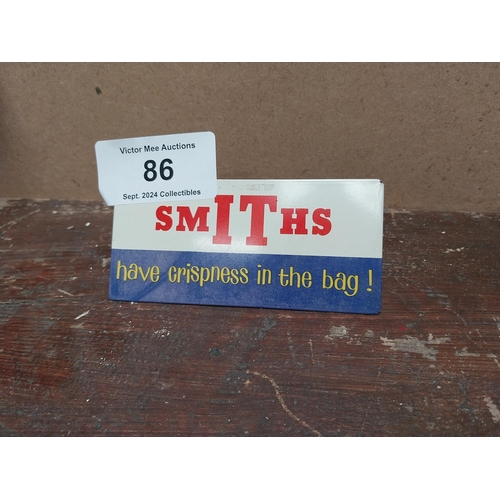 86 - Smith's Crisps in the bag tin plate advertising sign. {10 cm H x 7 cm W}.