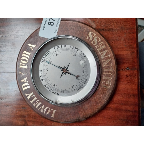 87 - Lovely Day for a Guinness wooden advertising barometer. {5 cm H x 20 cm Diam.}.