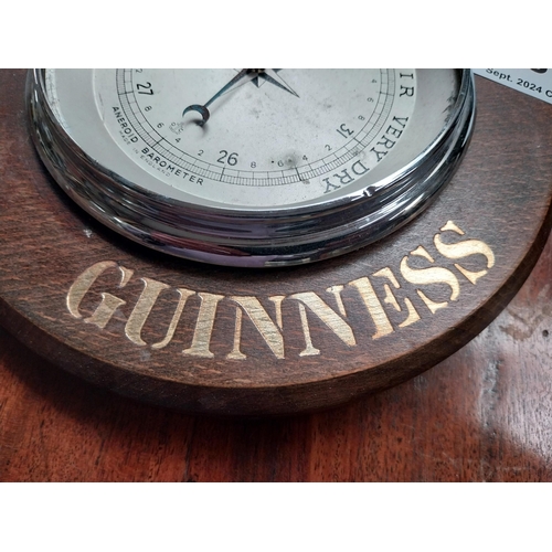 87 - Lovely Day for a Guinness wooden advertising barometer. {5 cm H x 20 cm Diam.}.