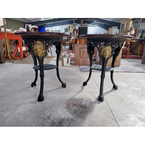 1260 - Pair of cast iron bar tables with mahogany tops. {70 cm H x 60 cm W}.