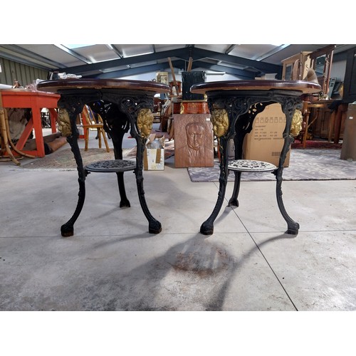 1260A - Pair of cast iron bar tables with mahogany tops. {70 cm H x 60 cm W}.