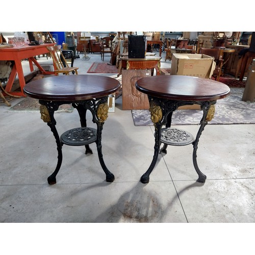 1260A - Pair of cast iron bar tables with mahogany tops. {70 cm H x 60 cm W}.