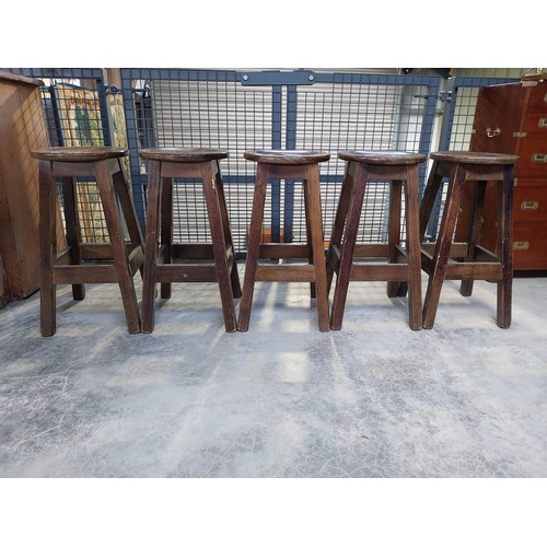 1265 - Five early 1970's mahogany and brass bar stools. {75 cm H x 36 cm Diam.}.