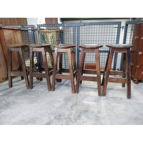 1265 - Five early 1970's mahogany and brass bar stools. {75 cm H x 36 cm Diam.}.