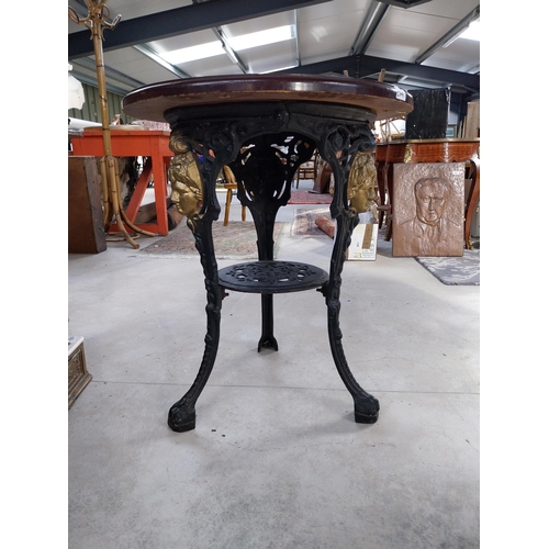 1260 - Pair of cast iron bar tables with mahogany tops. {70 cm H x 60 cm W}.