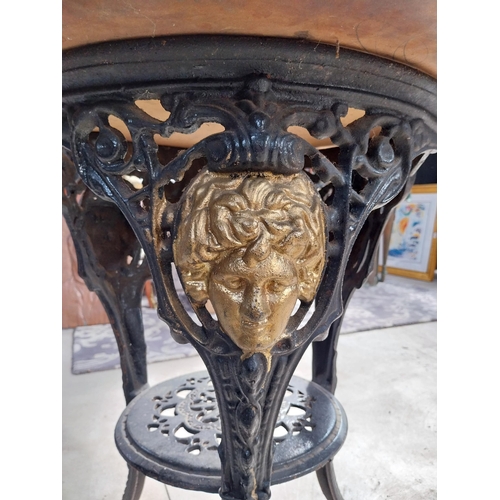 1260 - Pair of cast iron bar tables with mahogany tops. {70 cm H x 60 cm W}.