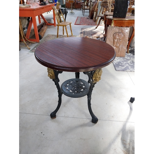 1260A - Pair of cast iron bar tables with mahogany tops. {70 cm H x 60 cm W}.