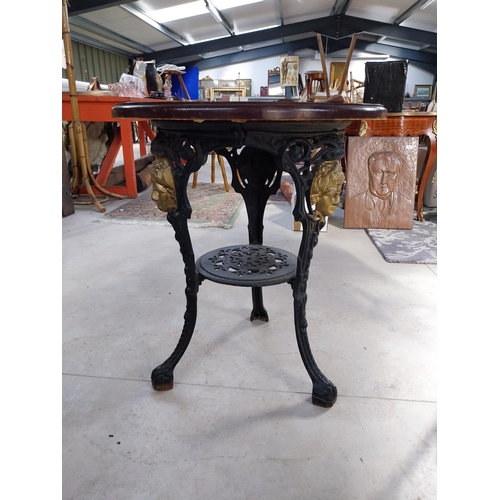 1260A - Pair of cast iron bar tables with mahogany tops. {70 cm H x 60 cm W}.