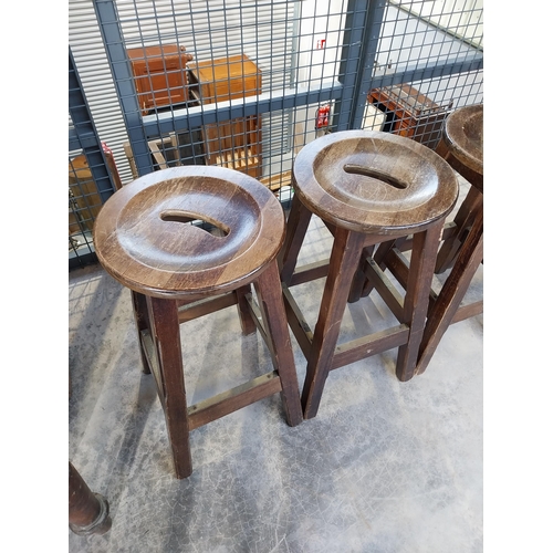 1265 - Five early 1970's mahogany and brass bar stools. {75 cm H x 36 cm Diam.}.