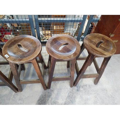 1265 - Five early 1970's mahogany and brass bar stools. {75 cm H x 36 cm Diam.}.