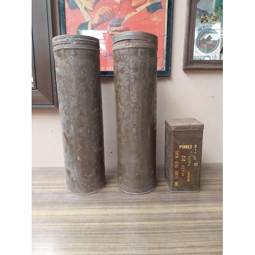 1368 - Three tinplate ammuniton boxes. {44 cm H x 15 cm Diam} and {20 cm H x 9 cm W x 9 cm D}.