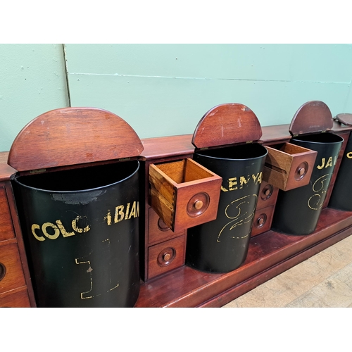 104 - Mahogany coffee bar/counter with four coffee bins and fifteen drawers {91cm H x 334cm W x 52cm D} 