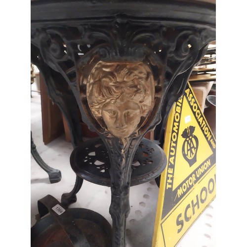 1275A - Pair of ornamental cast iron table bases. {111 cm H x 42 cm Diam.}