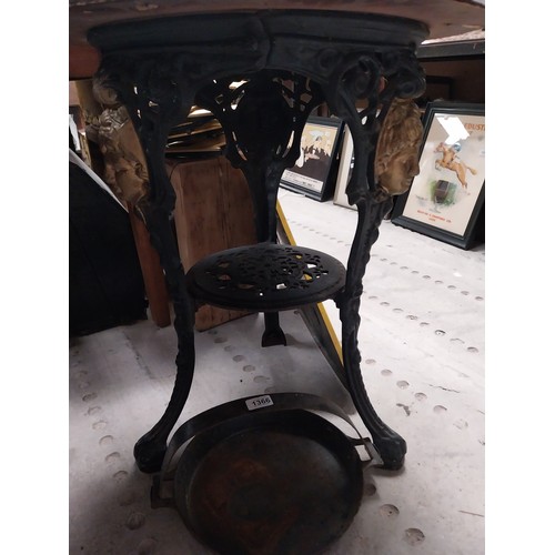 1275A - Pair of ornamental cast iron table bases. {111 cm H x 42 cm Diam.}