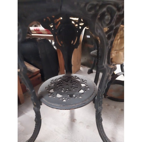 1275A - Pair of ornamental cast iron table bases. {111 cm H x 42 cm Diam.}