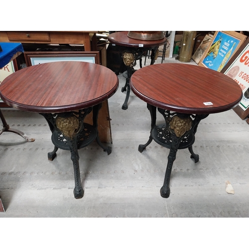 1275 - Pair of ornamental cast iron table bases. {111 cm H x 42 cm Diam.}