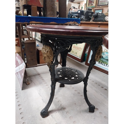 1275 - Pair of ornamental cast iron table bases. {111 cm H x 42 cm Diam.}