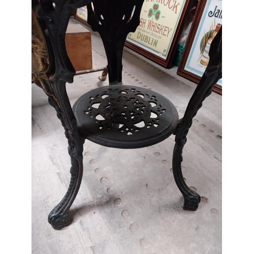 1275 - Pair of ornamental cast iron table bases. {111 cm H x 42 cm Diam.}