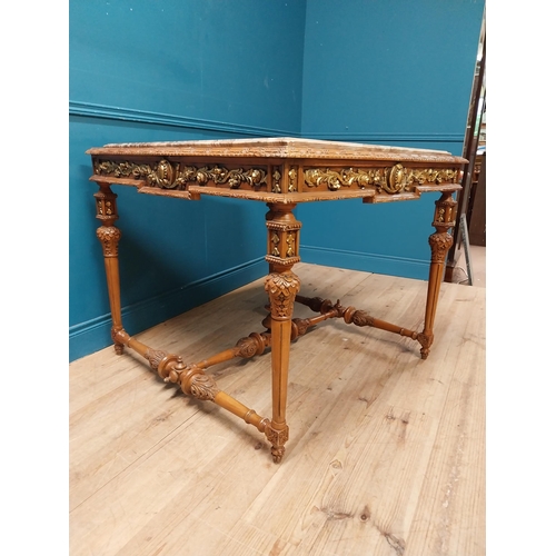 235 - Walnut and partial gilt centre table with marble top raised on carved turned legs {87 cm H x 104 cm ... 