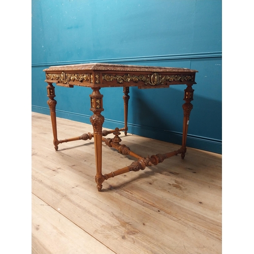 235 - Walnut and partial gilt centre table with marble top raised on carved turned legs {87 cm H x 104 cm ... 