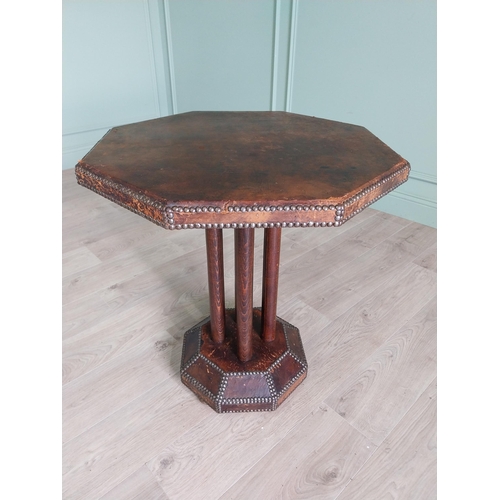 1173 - Rare early 20th C. leather brass studded table raised on oak columns and leather platform base {72 c... 