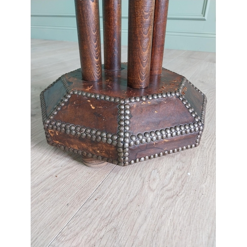 1173 - Rare early 20th C. leather brass studded table raised on oak columns and leather platform base {72 c... 