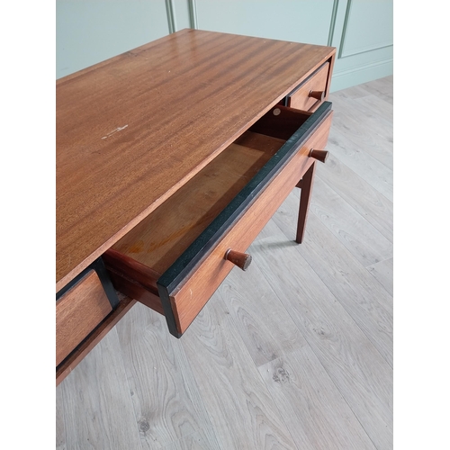 1133 - Mid-century teak desk with three drawers raised on square tapered legs and single stretcher {75 cm H... 