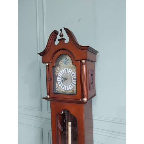 669 - Walnut Grandmother clock with brass dial {212 cm H x 45 cm W x 29 cm D}.