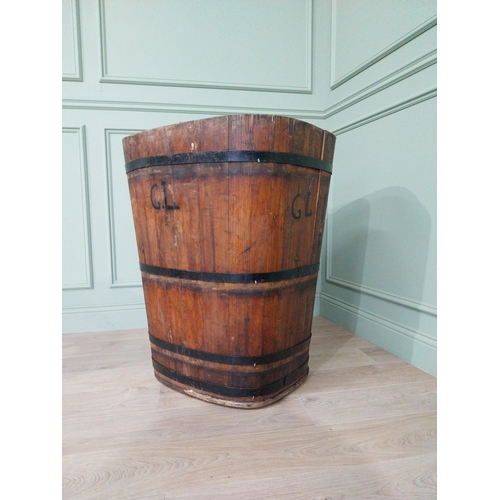 1092 - Early 20th C. metal bound pine log bucket {89 cm H x 71 cm W x 62 cm D}.