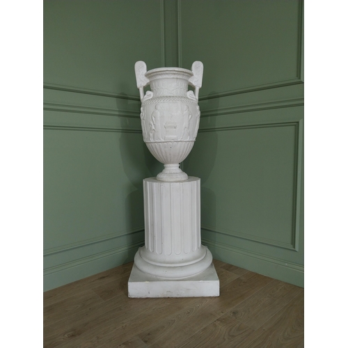 1146 - 20th C. Grand Tour plaster Grecian Urn on Pedestal. {147 cm H x 56 cm W x 56 cm D}.