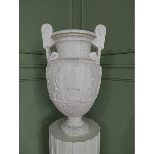 1146 - 20th C. Grand Tour plaster Grecian Urn on Pedestal. {147 cm H x 56 cm W x 56 cm D}.