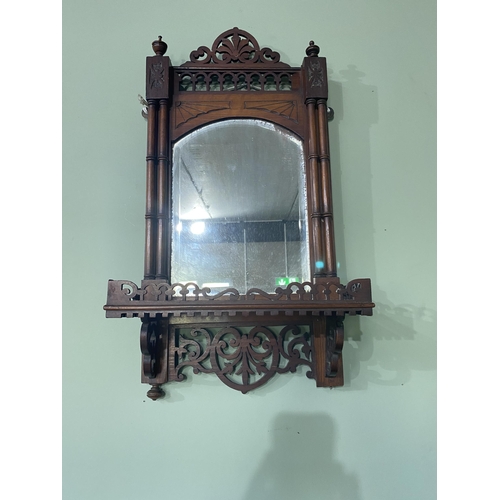 102 - Edwardian mahogany wall shelf with mirror backed in the Chippendale style {63 cm H x 31 cm W x 16 cm... 