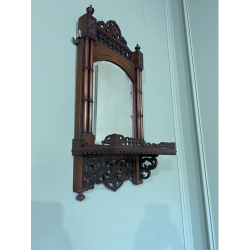 102 - Edwardian mahogany wall shelf with mirror backed in the Chippendale style {63 cm H x 31 cm W x 16 cm... 