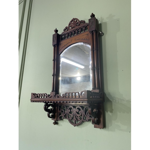 102 - Edwardian mahogany wall shelf with mirror backed in the Chippendale style {63 cm H x 31 cm W x 16 cm... 