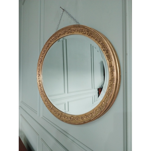 1023 - 19th C. giltwood oval wall mirror decorated with grape vines {67 cm H x 97 cm W}.