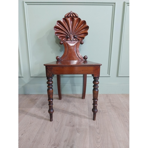 1035 - Pair of William IV mahogany hall chairs with shell back raised on turned legs {96 cm H x 43 cm W x 4... 