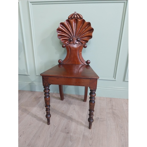 1035 - Pair of William IV mahogany hall chairs with shell back raised on turned legs {96 cm H x 43 cm W x 4... 