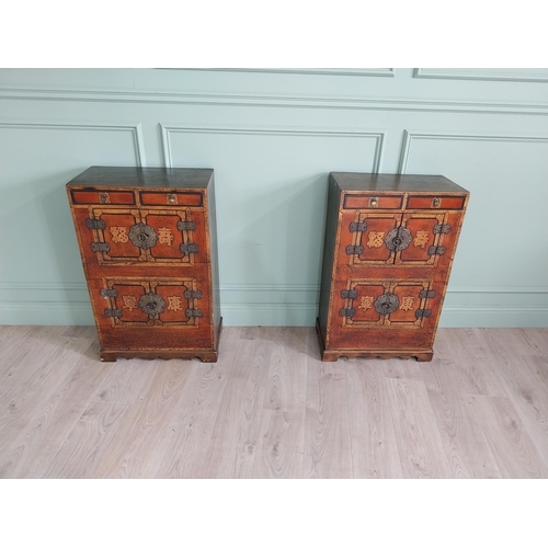 1043 - Pair of Oriental side cabinets with two drawers in the frieze above four blind doors and brass mount... 